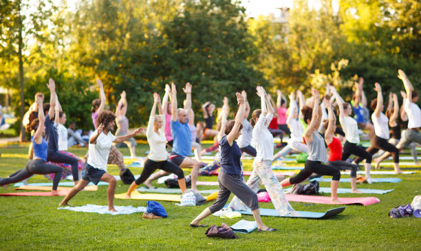 People practicing together at a group yoga session with analytics dashboard